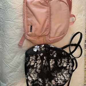 Two small backpack purses. One Victoria Secret and one Pink.